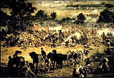 A chaotic scene depicting the Battle of Gettysburg, with soldiers, horses, and cannons amidst smoke and dust.
